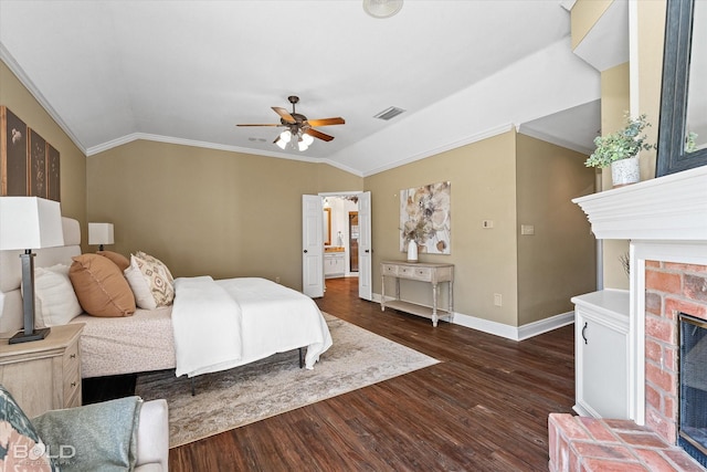 bedroom with crown molding, ceiling fan, dark hardwood / wood-style flooring, and vaulted ceiling