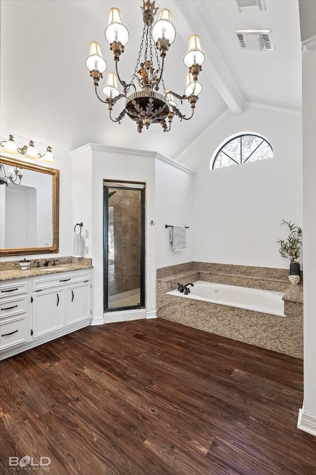 bathroom with wood-type flooring, separate shower and tub, lofted ceiling with beams, vanity, and a notable chandelier