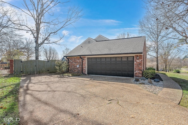 view of side of property with a garage