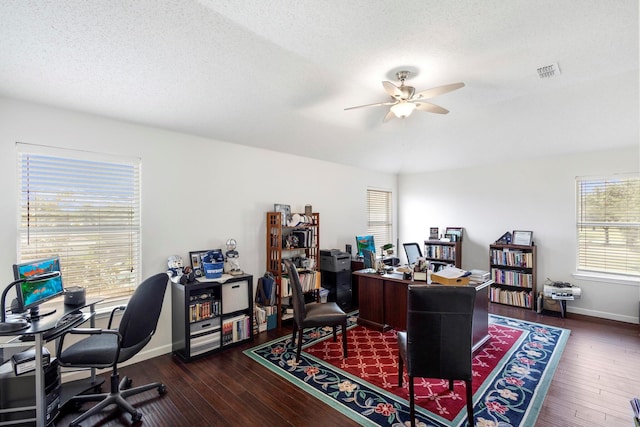 office area featuring ceiling fan, dark hardwood / wood-style flooring, and a textured ceiling