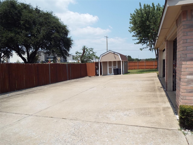 view of patio / terrace featuring a shed