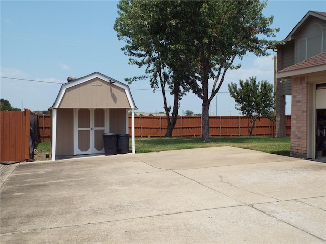 view of patio featuring a storage shed