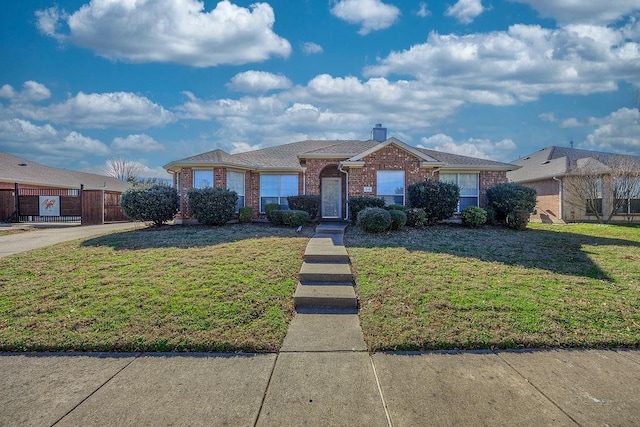 single story home featuring a front yard