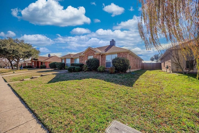 ranch-style home featuring a front yard