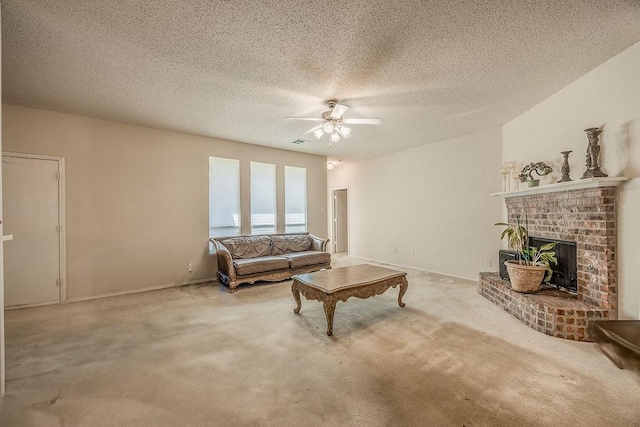 carpeted living room with ceiling fan, a textured ceiling, and a brick fireplace