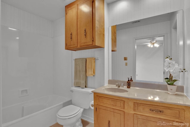 full bathroom featuring shower / tub combination, vanity, ceiling fan, and toilet