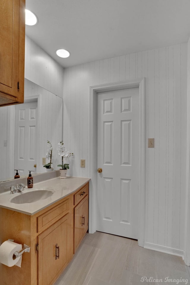 bathroom featuring vanity and hardwood / wood-style floors