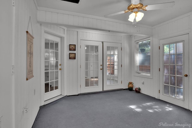 entryway featuring dark carpet, french doors, and ceiling fan