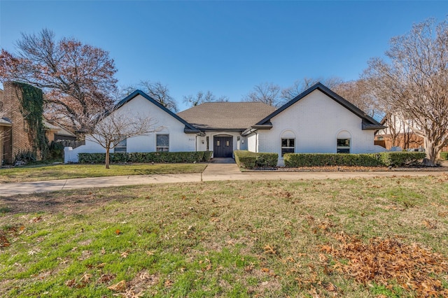 ranch-style house with a front yard