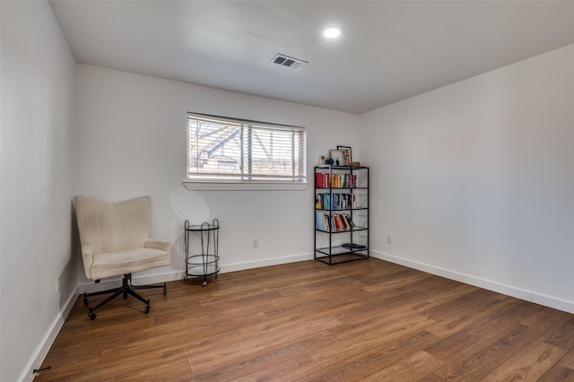 sitting room with hardwood / wood-style floors