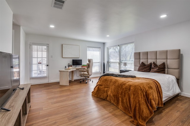 bedroom with light hardwood / wood-style floors