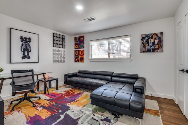 living room with dark hardwood / wood-style flooring