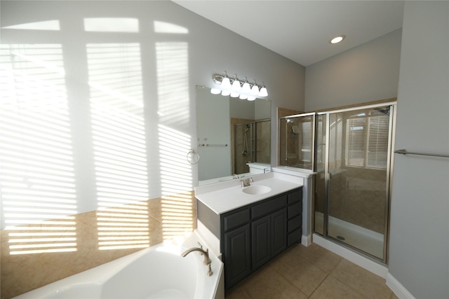 bathroom featuring a wealth of natural light, tile patterned flooring, and a shower stall