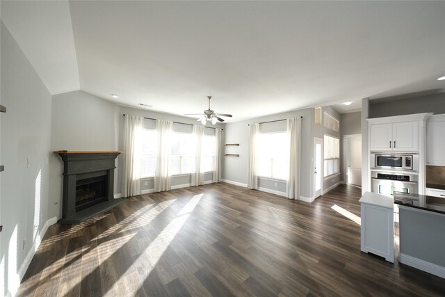 corridor with a chandelier, a barn door, and dark wood-type flooring