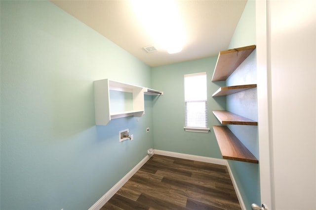 laundry area featuring baseboards, washer hookup, laundry area, dark wood-style floors, and electric dryer hookup