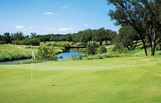 surrounding community featuring a water view