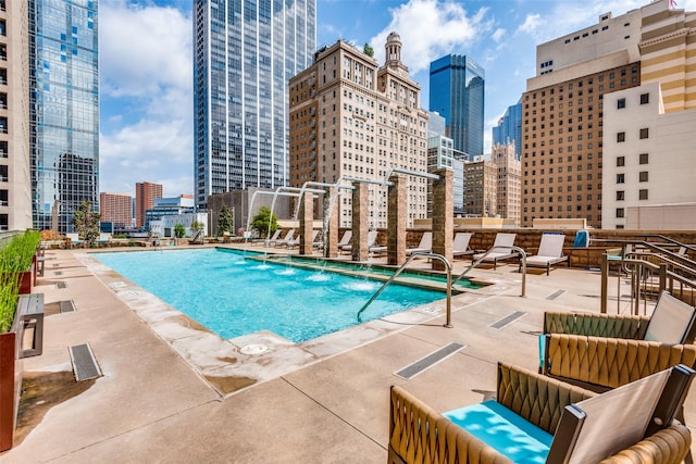 view of pool featuring a patio area and pool water feature