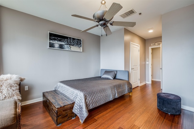 bedroom with ceiling fan and hardwood / wood-style floors