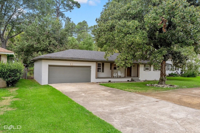 ranch-style home with covered porch, a garage, and a front lawn