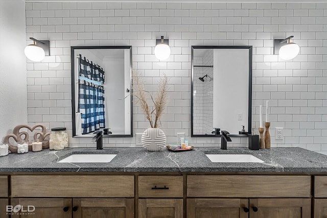 bathroom with vanity and tile walls