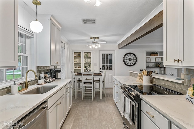 kitchen with range with electric stovetop, white cabinetry, dishwasher, sink, and hanging light fixtures