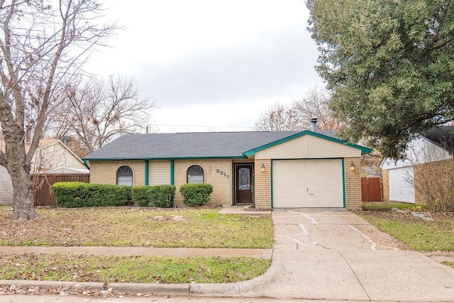 ranch-style house with a garage and a front yard