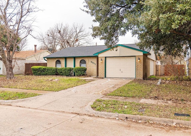 view of front of home with a front lawn and a garage