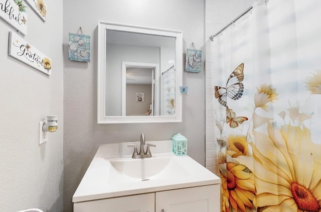 bathroom featuring vanity and walk in shower