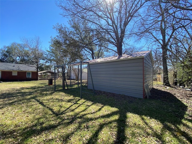 view of yard featuring a shed and an outbuilding