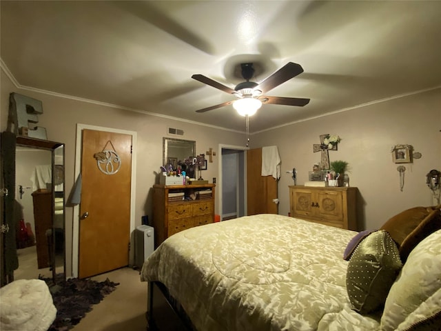 bedroom with light colored carpet, crown molding, visible vents, and ceiling fan