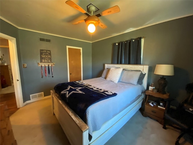 bedroom with light colored carpet, visible vents, and crown molding