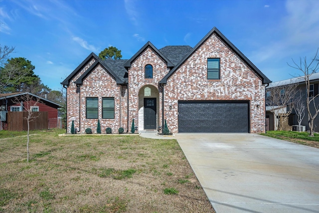 view of front facade with a garage, a front lawn, and cooling unit