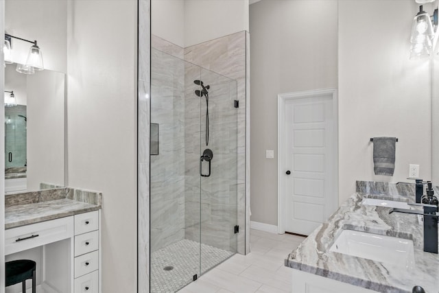 bathroom featuring walk in shower and vanity