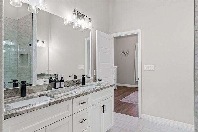 bathroom featuring vanity and a shower with shower door