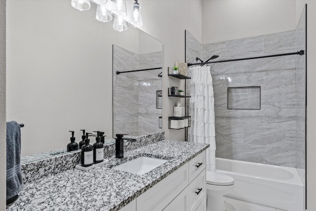 full bathroom with vanity, toilet, and shower / bath combo