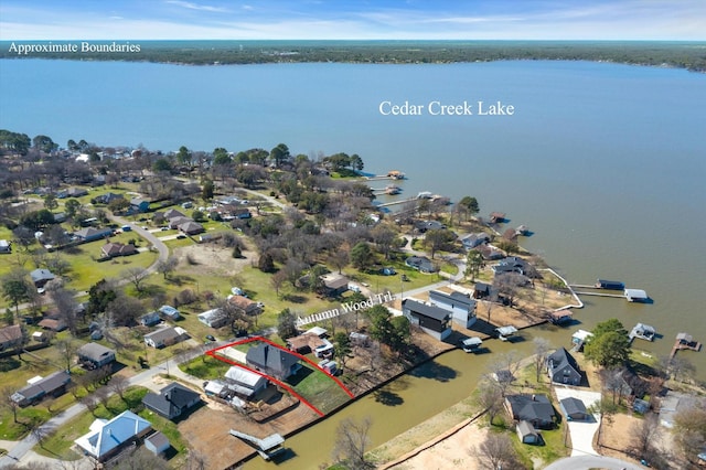 drone / aerial view featuring a water view and a residential view