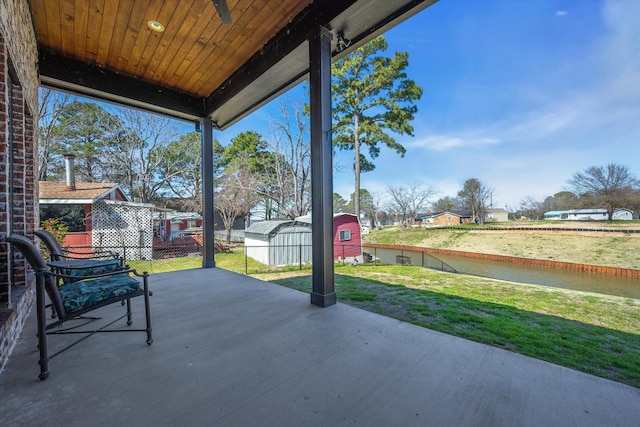 view of patio with a shed