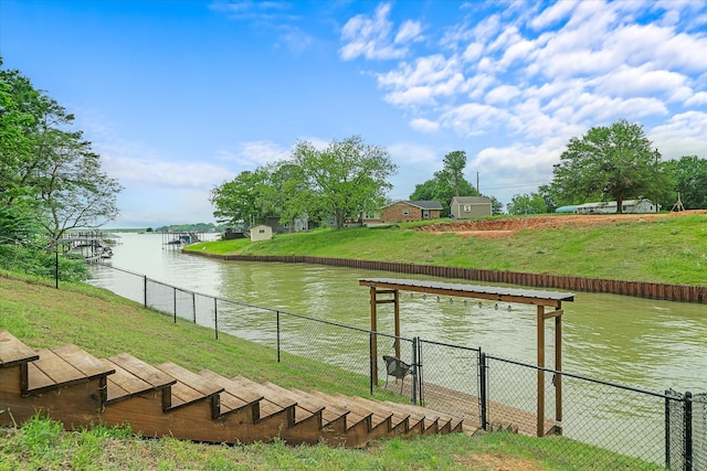 view of water feature with fence