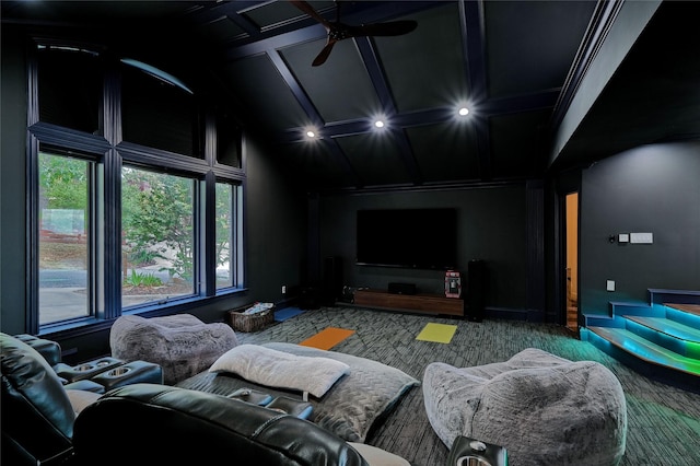 carpeted home theater room with ceiling fan and lofted ceiling