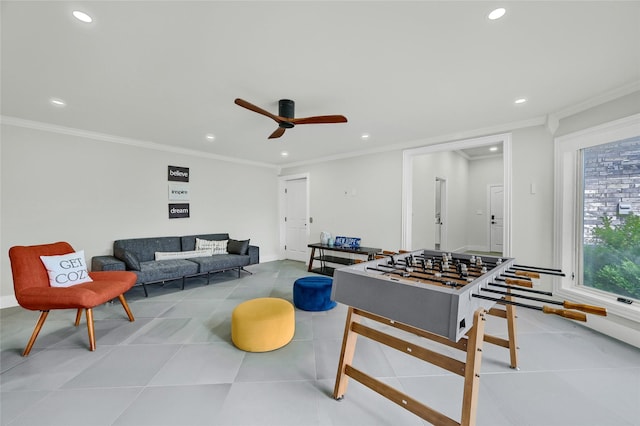 playroom featuring crown molding and ceiling fan