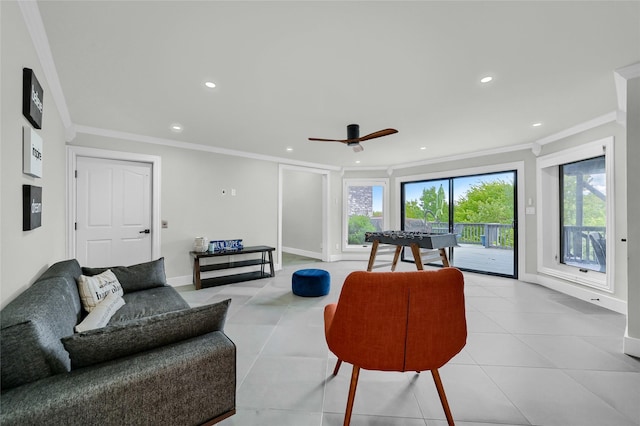 tiled living room featuring ceiling fan and ornamental molding