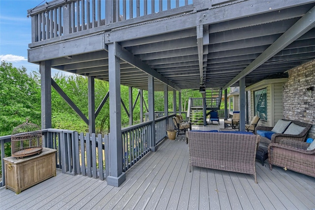 wooden terrace featuring an outdoor hangout area