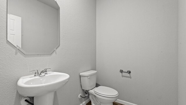 bathroom with toilet and sink