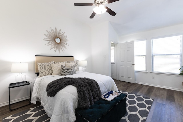 living room featuring ceiling fan, dark hardwood / wood-style flooring, and vaulted ceiling