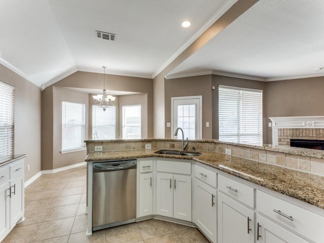 kitchen featuring white cabinetry, sink, pendant lighting, and dishwasher