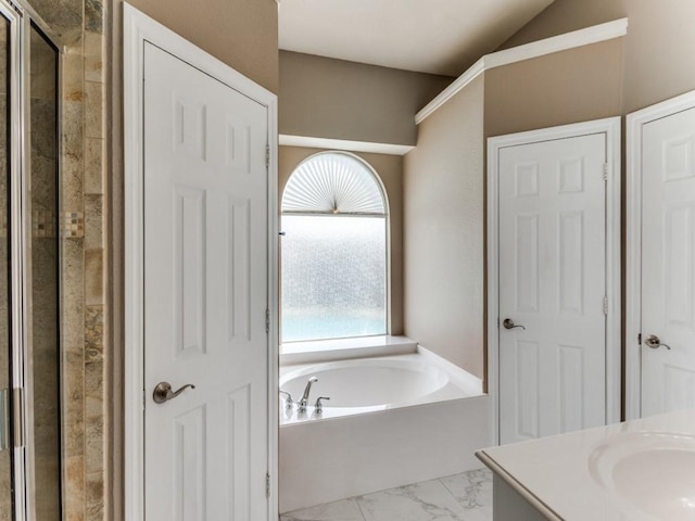 bathroom featuring vanity and plus walk in shower