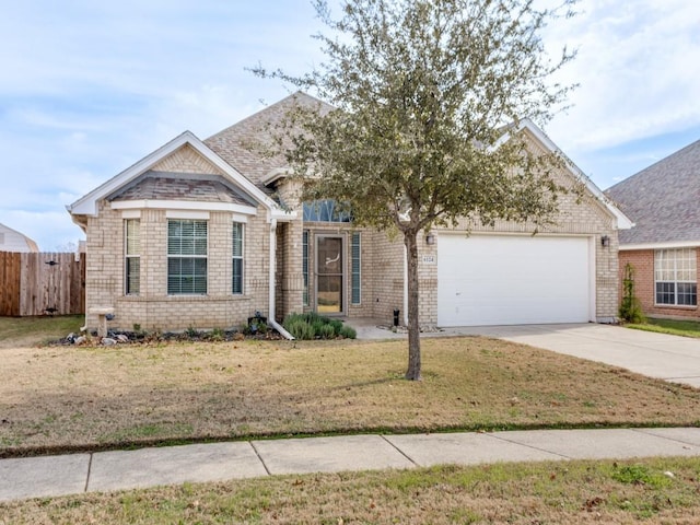 view of front facade with a garage and a front lawn