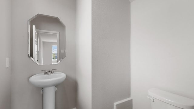 bathroom with sink and toilet