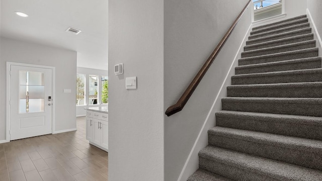 staircase featuring hardwood / wood-style floors