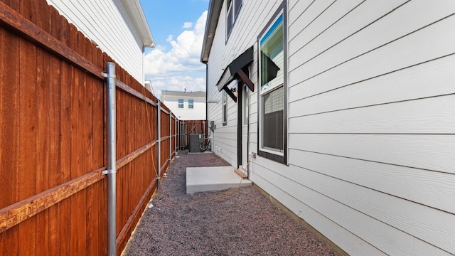 view of side of property featuring central AC